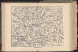 Offenes Buch mit detaillierter Deutschlandkarte mit Straßen, Städten und geografischen Merkmalen.