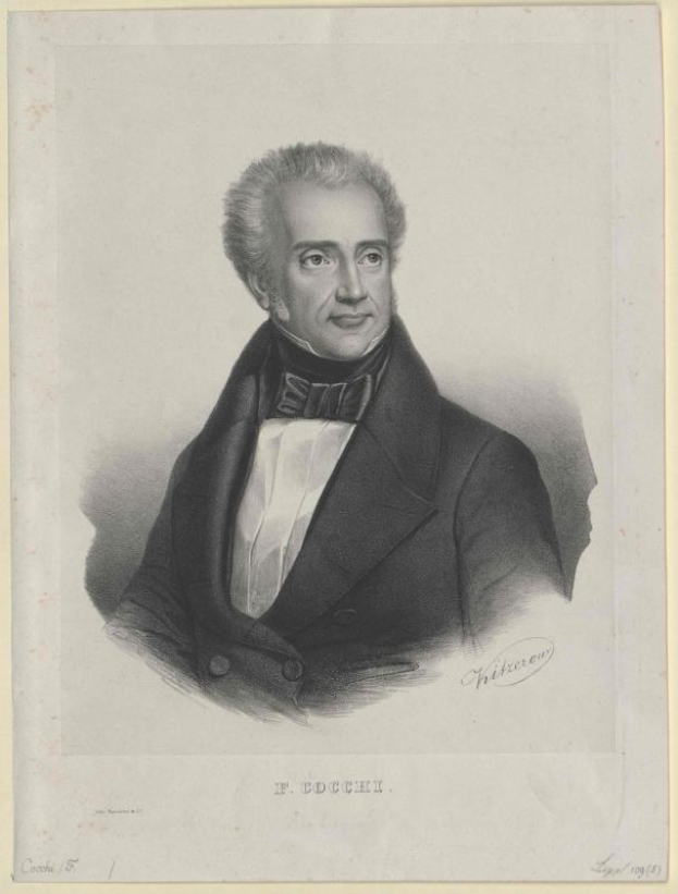 Schwarzes und weißes Porträt des Komponisten F. Cocchi in einem Smoking, mit der Aufschrift "Die Musik der Oper" unten.