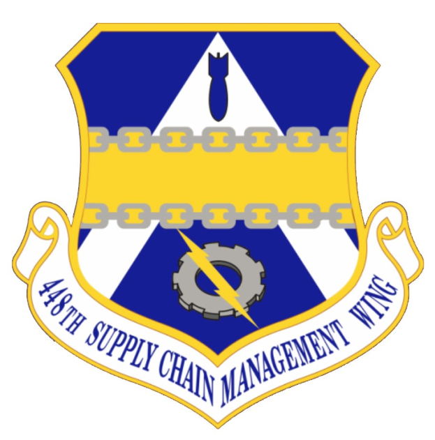 Logo der 48. Versorgungsmanagement-Flügel mit einem blauen Schild mit einem weißen Stern, einem weißen Banner mit blauer Schrift 'Versorgungsmanagement' und schwarzer Schrift '48. Versorgungsmanagement-Flügel' in fetter Schrift.