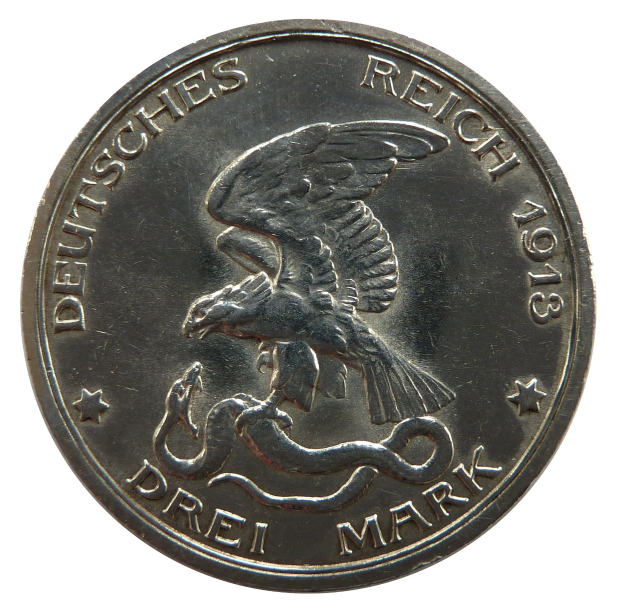 Eine Silbermünze mit einem Adler, der eine Schlange in seinen Klauen hält und mit ausgebreiteten Flügeln gegen einen weißen Hintergrund, mit dem Text "Deutsches Reich" sichtbar.